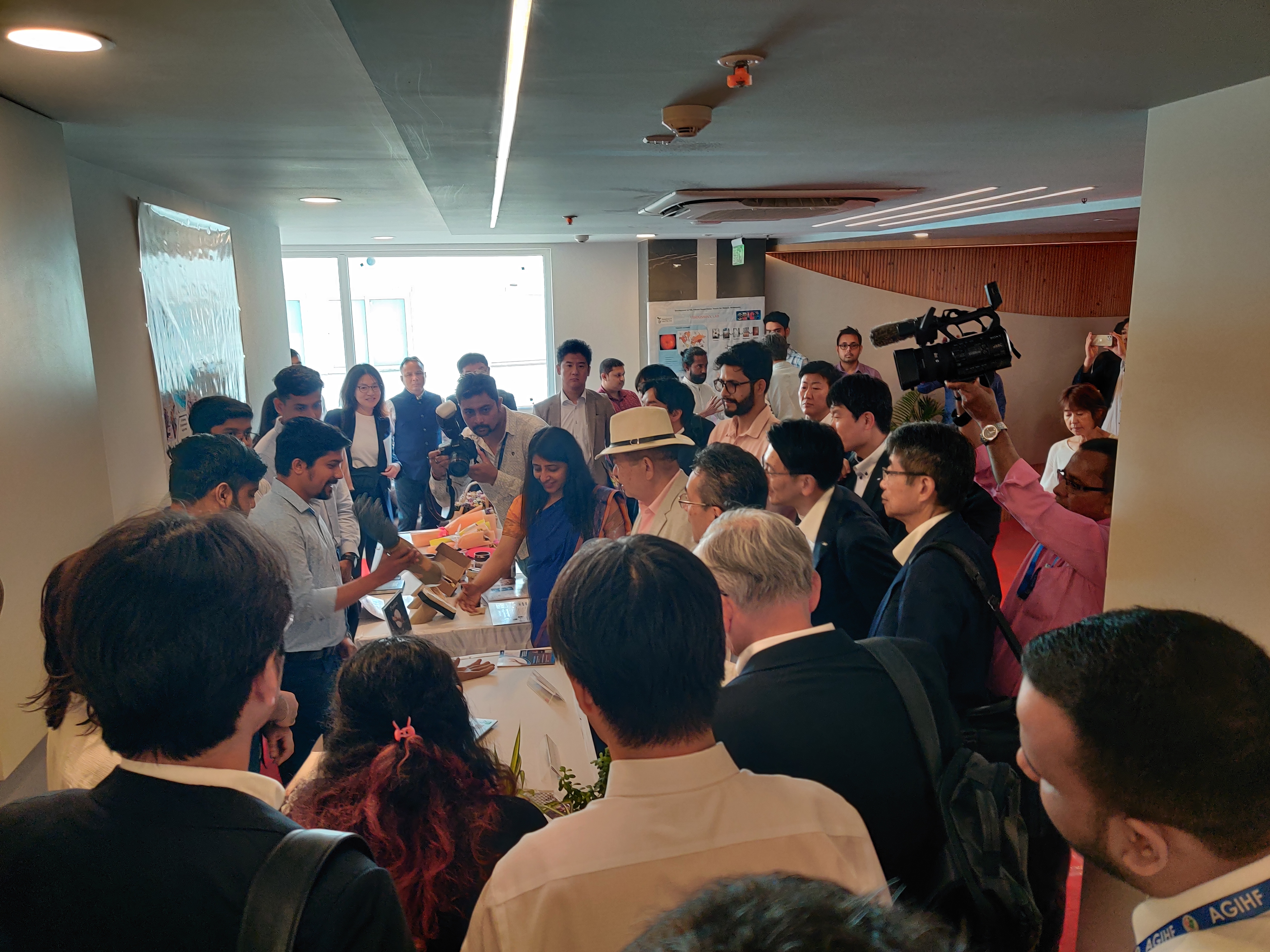 Visitors gathered around a Symbica product demonstration